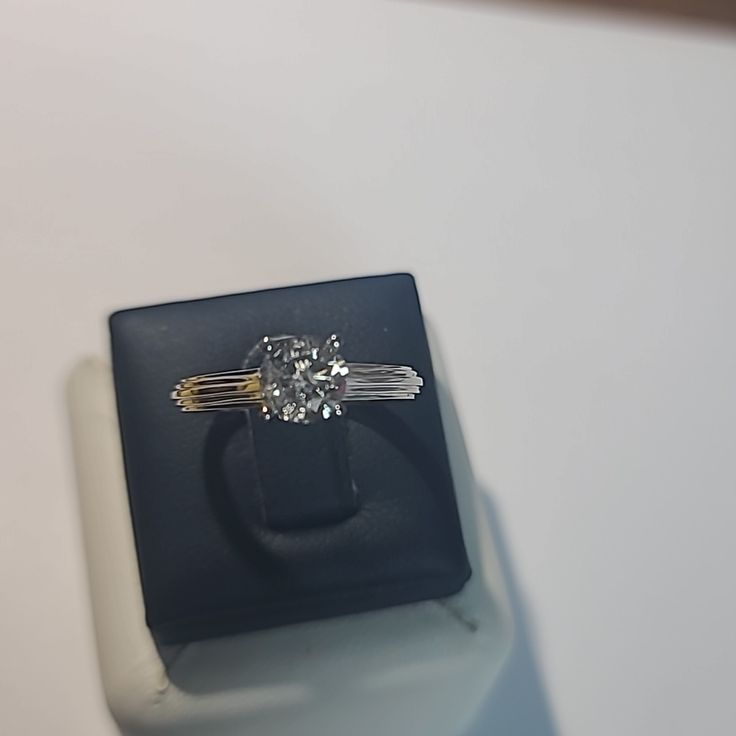 This Jewelery Is New With Tags, Never Worn. Cathedral Rib Shank Style Solitaire 4 Prong Natural Diamond Center Stone I Color, I-2 Clarity, 0.90ct, 2 Other Bezel Diamonds Set In Gallery , 1.00ctw Entire Ring. 14kt White Solid Gold, This Ring May Be Sized Up Or Down 1 Size At Your Local Jeweler. Ring Is Hallmarked 14kt.,.90ct My Price On This Jewelry Is Firm. Jewelry Is Guaranteed As Described Above. Sku#5001 Platinum Diamond Ring With Baguette Cut For Gift, Gia Certified Baguette Cut Ring As Gift, Baguette Cut Platinum Diamond Ring For Gift, Gia Certified Cushion Cut White Gold Wedding Ring, Classic Cut Diamond Ring Gift, Cushion Cut Diamond Ring In Yellow Gold And Platinum, Vvs Clarity Classic Cut Diamond Ring Gift, Platinum Jewelry With Brilliant Cushion Cut, Classic Radiant-cut Platinum Jewelry