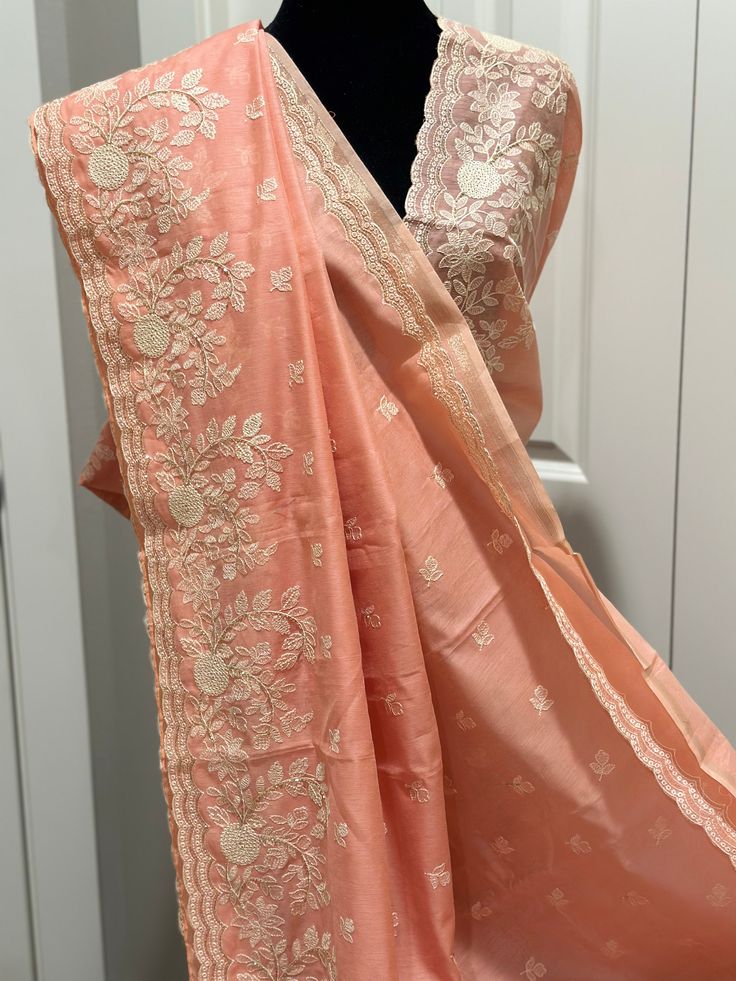 Words can not describe the beauty of this saree...simplicity and elegance redefined... Embroided with scalloped border and embellished with CutDana ... it's just a very beautiful yet simple saree... Color Peach Saree is light , drapes easily , has a beautiful shine and overall a very good choice. CutDana elevates the saree to another level. The saree is ready to wear with falls, pico and beautiful handwoven tassels , and unstitched blouse fabric is included. Note: Colors that show up on your scr Unstitched Peach Traditional Wear For Diwali, Traditional Chanderi Blouse Piece In Peach, Traditional Peach Chanderi Blouse Piece, Festive Peach Chanderi Blouse Piece, Elegant Peach Designer Wear Blouse Piece, Elegant Peach Traditional Wear For Festive Occasions, Elegant Peach Traditional Festive Wear, Peach Dupatta With Resham Embroidery For Diwali, Unstitched Peach Traditional Wear For Festive Occasions