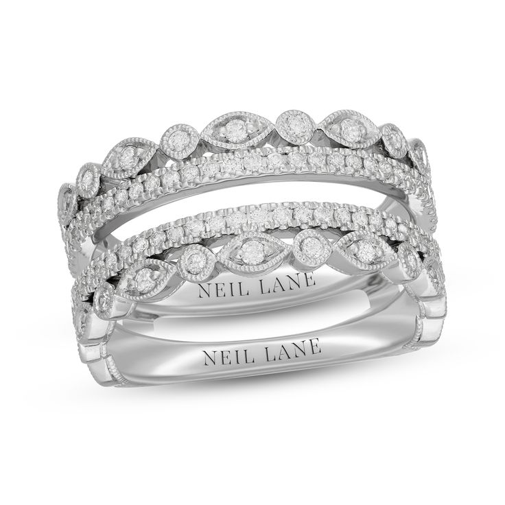 a white gold wedding ring set with round diamonds on the sides and an inscription that says, well lane