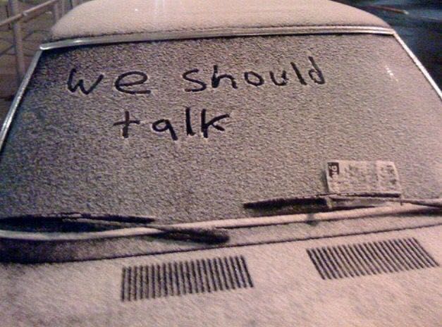 we should talk written on the windshield of a car