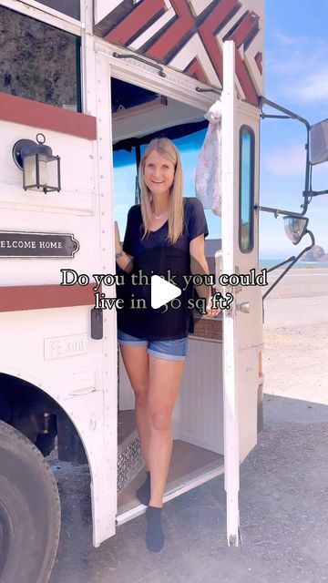 a woman standing in the doorway of a food truck