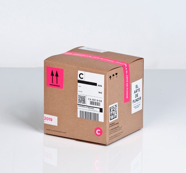 a cardboard box with a pink sticker on it