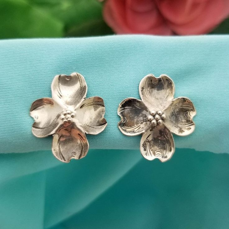 TRUE VINTAGE Sterling Silver Dogwood Non-Pierced Screw-On Earrings- Beautifully Crafted.  Made in the 1940s.  These Sweet Earrings feature a Beautiful Dogwood Flower that has a Brushed Finish with an Antique Look. Made from Solid Sterling Silver, these Earrings are an Adorable Accessory for Spring/Easter.  The Dogwood Flowers measure 7/8'' Wide The Earrings measure 7/8'' Wide Screw-On (for Non-Pierced Ears) Weighs 2.95 Grams Vintage Nickel-free Clip-on Earrings For Anniversary, Vintage Silver Screw Back Earrings, Vintage Silver Pierced Flower Earrings, Vintage Silver Flower Earrings Pierced, Vintage Silver Handmade Flower Earrings, Vintage Handmade Silver Flower Earrings, Silver Vintage Flower Earrings For Anniversary, Silver Vintage Flower Earrings For Formal Occasions, Silver Vintage Flower Earrings