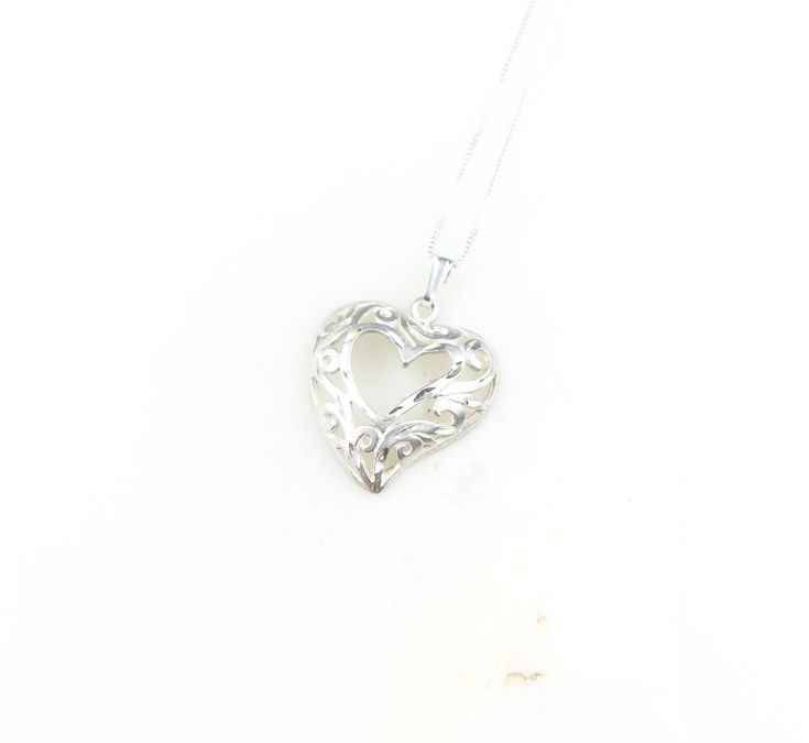 Vintage 925 Deco Sterling Silver Filigree Heart Pendant Necklace 18" 925 chain  Measurements are provided in photos.  View all photos!  Please note in our shops policies we do not allow returns. We are happy to answer any questions or concerns you may have before purchasing! :) Engraved Open Heart Sterling Silver Jewelry, Engraved White Gold Open Heart Necklace, Elegant Sterling Silver Heart Necklace Stamped 925, Sterling Silver Heart Pendant Necklace, Engraved Sterling Silver Open Heart Jewelry, Sterling Silver Heart Pendant Necklace Stamped 925, 925 Sterling Silver Heart Pendant Necklace For Anniversary, Stamped 925 Heart Pendant Necklace As Gift, Sterling Silver Heart Necklace With Round Pendant For Mom