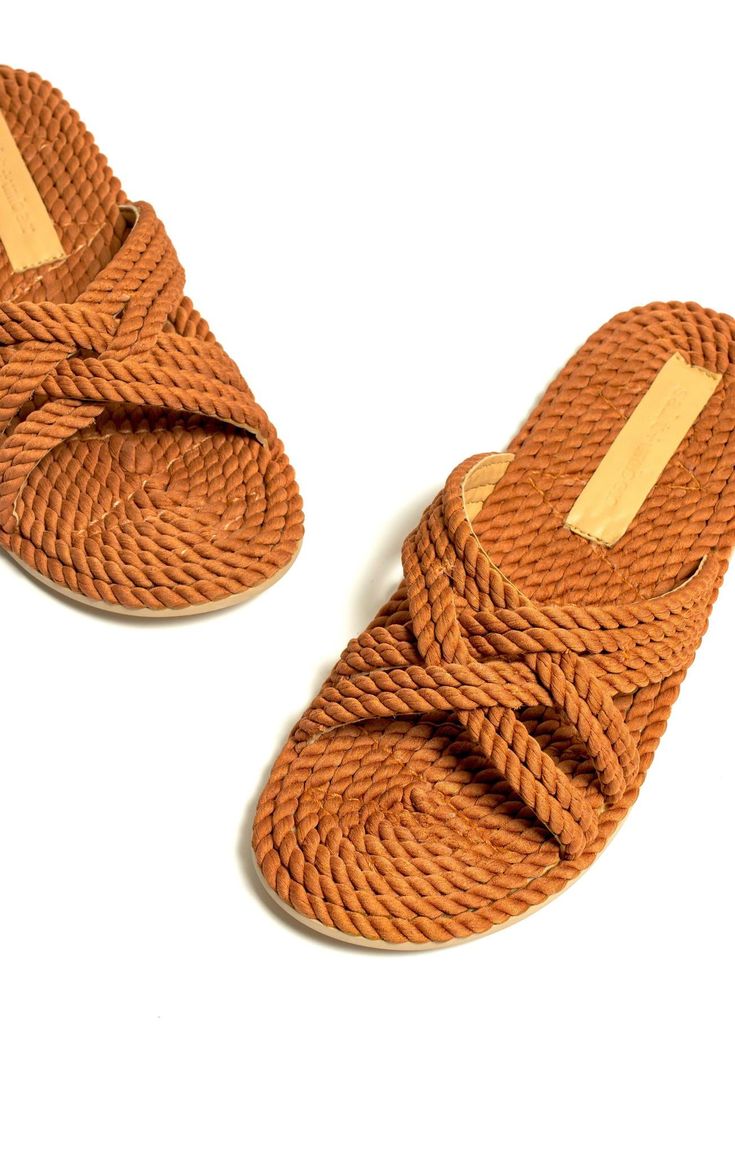 salt+umber sustainably and ethically handmade sandal Casual Braided Sandals In Natural Color, Casual Beach Sandals With Rope Detail, Orange Slides For Beach In Summer, Orange Slides For Summer Beach, Orange Slides For Summer Beach Days, Brown Braided Sandals For The Beach, Brown Beach Mules With Woven Sole, Brown Slides With Woven Sole For Vacation, Brown Braided Sandals For Vacation