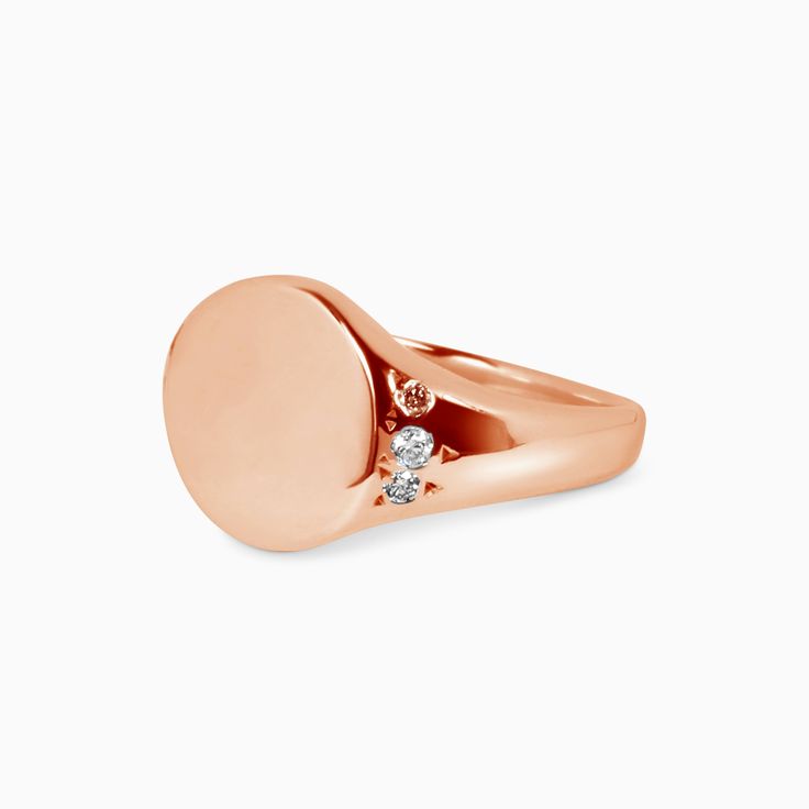 This petite classic Signet Ring makes a statement. The ring surface is a 10x10mm circle, domed on either side with small diamond accents. The signet ring has been used throughout history and across cultures to showcase family crests and position in society. For an added touch, include details for a complimentary monogram or symbol in your notes upon check out. All monograms and symbols are hand-engraved by Brooklyn Engravings. Before your signet ring is hand engraved an email will be sent to you Timeless Domed Signet Ring With Polished Finish, Domed Signet Ring With Polished Finish For Anniversary, Domed Signet Ring With Polished Finish For Gift, Modern Signet Ring With Single Diamond, Luxury White Gold Signet Ring With Single Diamond, Luxury Domed Signet Ring For Formal Occasions, Formal Signet Ring With Polished Round Stone, Luxury Signet Ring With Brilliant Cut, Formal Signet Ring With Polished Finish