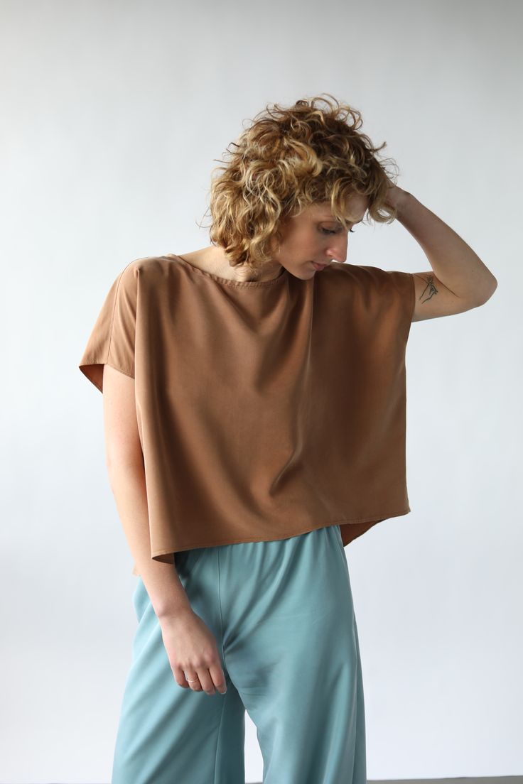 Oversize modal blouse. Cropped front, loose sleeves.   - Oversize fit style blouse  - Round neckline - Short loose kimono style sleeves - Handmade by our family Brown Relaxed Fit Blouse For Summer, Summer Relaxed Boxy Fit Tops, Chic Boxy Summer Tops, Casual Boxy Summer Blouse, Summer Brown Relaxed Fit Blouse, Chic Boxy Fit Tops For Summer, Versatile Brown Summer Tops, Versatile Short Sleeve Crop Top With Relaxed Fit, Versatile Relaxed Fit Crop Top With Short Sleeves