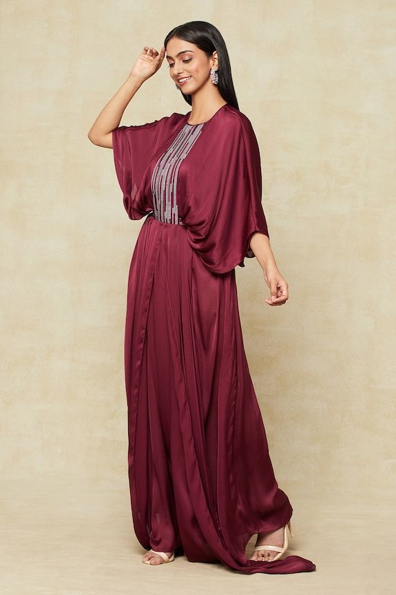 Purple front pleated kaftan with metallic embellished yoke and an attached embellished tie-up belt. - Aza Fashions Elegant Evening Kaftan With Draped Sleeves, Embellished Kaftan With Kimono Sleeves For Eid, Festive Embellished Kaftan With Kimono Sleeves, Elegant Festive Kaftan With Cape Sleeves, Eid Embellished Kaftan With Kimono Sleeves, Elegant Kaftan For Reception, Elegant Embellished Kaftan For Formal Occasions, Formal Embellished Kaftan, Elegant Festive Kaftan With Draped Sleeves