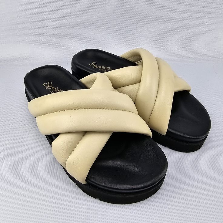 Pillowy Leather Straps Cross At The Vamp Of A Chic Slide Sandal Set On A Cushy, Step-Supporting Footbed And Platform Sole. 1 1/2" Heel; 1" Platform Cushioned Footbed Leather Upper And Lining/Synthetic Sole New Unused Condition Womens Size 7 Ivory/Black Please No Low Balls, Posh Takes 20% And Sellers Pay Tax Fees Reasonable Offers Welcomed. Cream Cushioned Slip-on Sandals, Chic Cream Wedge Sandals With Cushioned Footbed, Cream Synthetic Sandals With Cushioned Footbed, Casual Off White Round Toe Sandals, Cream Slides With Removable Insole And Round Toe, Cream Sandals With Cushioned Footbed For Vacation, Cream Cushioned Sandals For Vacation, Cream Round Toe Slides For Spring, Cream Slides With Cushioned Footbed For Spring