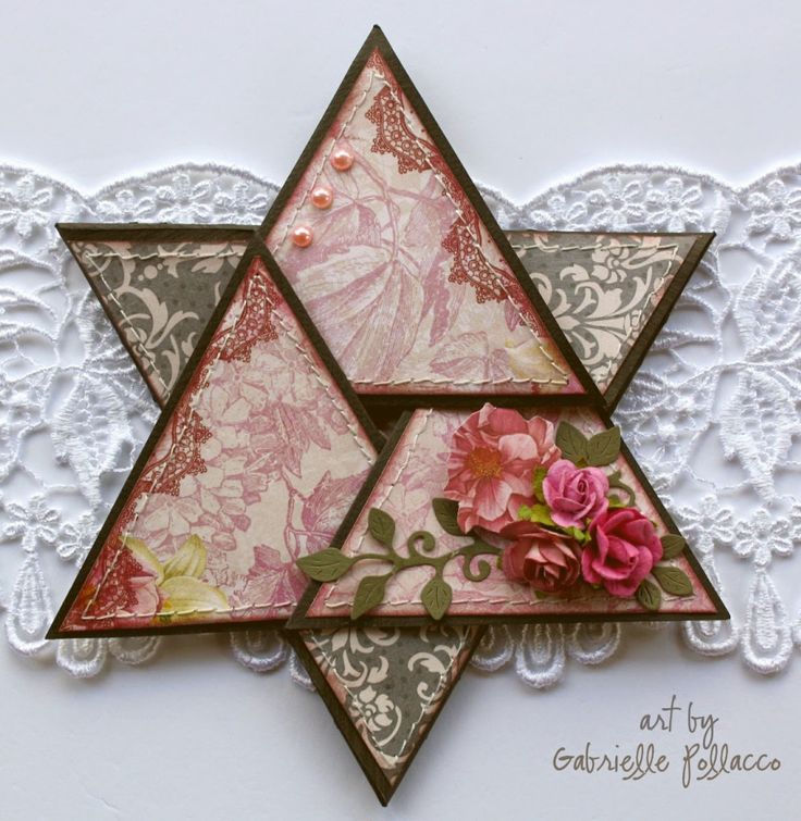 a card with an image of a star of david and pink flowers on the front