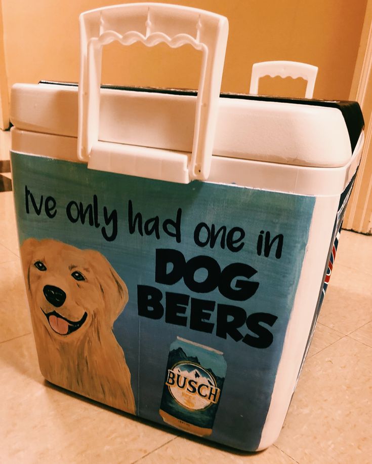 a cooler bag with an image of a dog holding a beer can on the side