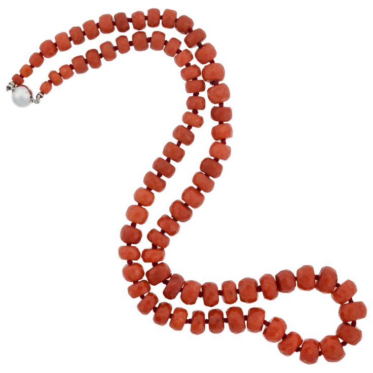 This vintage coral bead necklace is simply stunning! The simple design features a row of graduating coral beads, which are hand strung on red thread, and knotted in between. The coral is natural and untreated, displaying a beautiful range of deep orange and red colors. Each bead is lightly faceted, giving the surface a soft, light-catching sparkle. The necklace fastens securely in the back with a modern 14kt white gold clasp (stamped "585" inside), which is magnetized for ease and convenience. When worn, the strand of beads drapes beautifully below the neckline, where it makes a prominent and colorful statement. Perfect for the coral lover, this gorgeous necklace would look equally beautiful worn alone or layered with other beads! The necklace measures 19.5" in total length (including the Coral Beads Necklace, Deep Orange, Red Thread, Natural Coral, Coral Necklace, Coral Beads, Gorgeous Necklaces, Bead Necklace, Simple Design