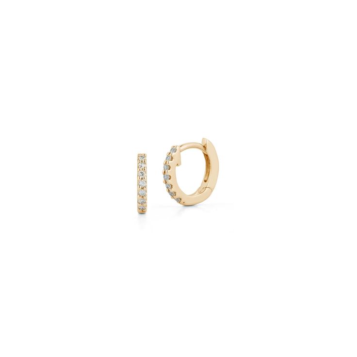 These pavé-set diamond and gold mini huggie earrings are a perfect size for those looking to fill 2nd, 3rd, 4th etc. piercings, or for those with petite earlobes. These diamond huggies hug your earlobe just right and are a brilliant addition to your ear stack. For most people, the mini huggies will fit in your second or third piercing, but some can wear these in their first hole. These diamond huggie earrings are the everyday staple earrings you've been hunting for. They are a favorite of the Da Fine Jewelry Huggie Earrings With Pave Setting, 14k Gold Huggie Earrings With Pave Setting, Minimalist Yellow Gold Huggie Earrings With Pave Setting, Yellow Gold Diamond Huggie Earrings With Pave Setting, Cubic Zirconia Huggie Piercings, Third Piercing, Staple Earrings, Dana Rebecca Designs, Diamond Huggie Earrings