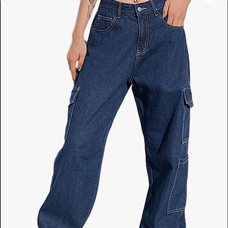 High Waist Wide Leg Straight Jeans With Multi Pockets Baggy Streetwear Denim. Jeans Have A Zip And Button Closure, Two Side Pockets On The Left Leg And On One Side Pocket On The Right. It Also Has 3 Pockets In The Front And Two In The Back. Casual Blue Pants With Flap Pockets, Y2k Denim Bottoms With Pockets, Y2k Style Baggy Jeans With Pockets, Blue Relaxed Fit Jeans With Pockets, Blue High Rise Cargo Jeans Y2k Style, Y2k Denim Blue Bottoms With Pockets, Denim Blue Y2k Pants With Pockets, Y2k Style Denim Blue Bottoms With Pockets, Casual Blue Jeans With Pockets