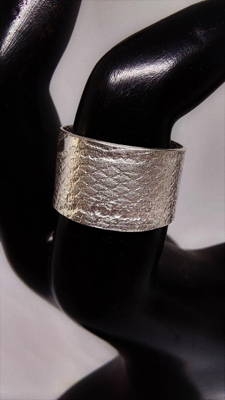 Hand-crafted texture Sterling silver band. Approximately 1/2" inches, Size 7 1/2 Elegant Thick Silver Band, Elegant Silver Thick Band, Modern Decorative Band As Gift, Modern Decorative Bands As Gifts, Modern Wide Band As Gift, Silver Metal Band Jewelry, Silver Band Jewelry In Metal, Modern Wide Band Rings For Gifts, Modern Wide Band Gift