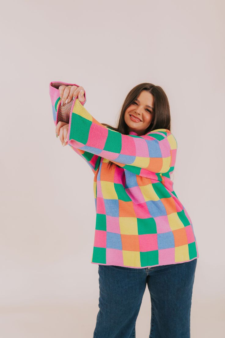 Fashionably transition between seasons in this vibrant PLUS SIZE - Between Places Sweater! With its cheerful multi-colored checker pattern, ribbed neckline, and pullover style, you can make a statement while staying comfortable. Details Multi-color blocked checker pattern Pullover sweater Ribbed neckline Colors are pink, blue, lime, orange, and green Sizing *Measurements are taken unstretched with item hanging* Approximate measurements: SIZE LENGTH BUST 1XL 29.5" 54" 2XL 30" 56" 3XL 30.5" 58" Fa Multicolor Crew Neck Sweater For Loungewear, Playful Multicolor Long Sleeve Sweater, Spring Multicolor Sweater For Loungewear, Colorful Playful Sweater For Fall, Playful Fall Tops In Bright Colors, Nursing Friendly Tops, Free People Sandals, Nursing Friendly Dress, Plus Jumpsuit