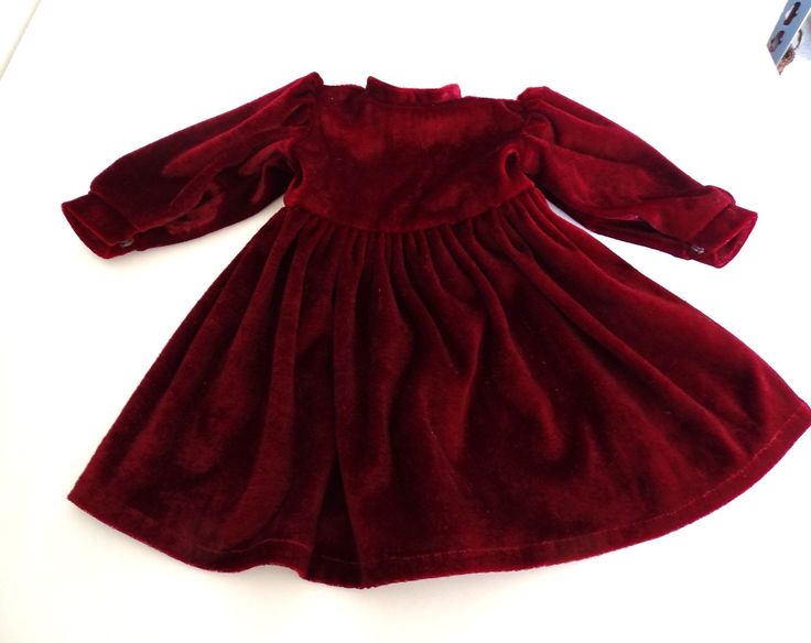 Nice quality in clean condition, no stains, holes or fading. Soft velvet with 3 hidden back snaps. Measures 10.5" long, 5" shoulder to shoulder, 6" long sleeve with 3" around wrist opening, 12" around waist.. Item # 1S-36 Red Velvet Dress, Doll Clothing, Burgundy Red, Soft Velvet, Velvet Dress, Doll Toys, Medium Size, Red Velvet, Clothing Items