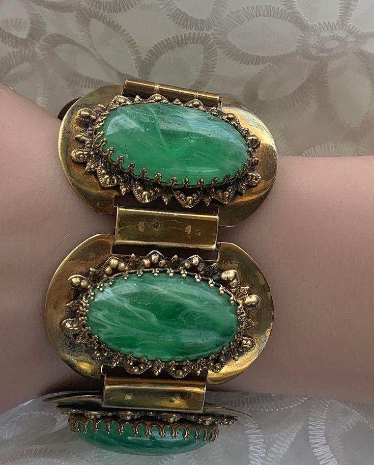 Beautiful chunky statement piece with green lucite cabochons and copper bracelet.  Large 1.25 Lucite cabochons and copper tone amazing color combination. The detail in in the metal surrounding and holdin cabochon is amazing. Mid-century Green Collectible Jewelry, Retro Green Bracelet Jewelry, Antique Green Handmade Bracelet, Handmade Antique Green Bracelet, Retro Green Bracelet For Gift, Retro Green Bracelets For Gifts, Retro Green Bracelet Gift, Green Retro Bracelet As A Gift, Retro Green Bracelets For Gift