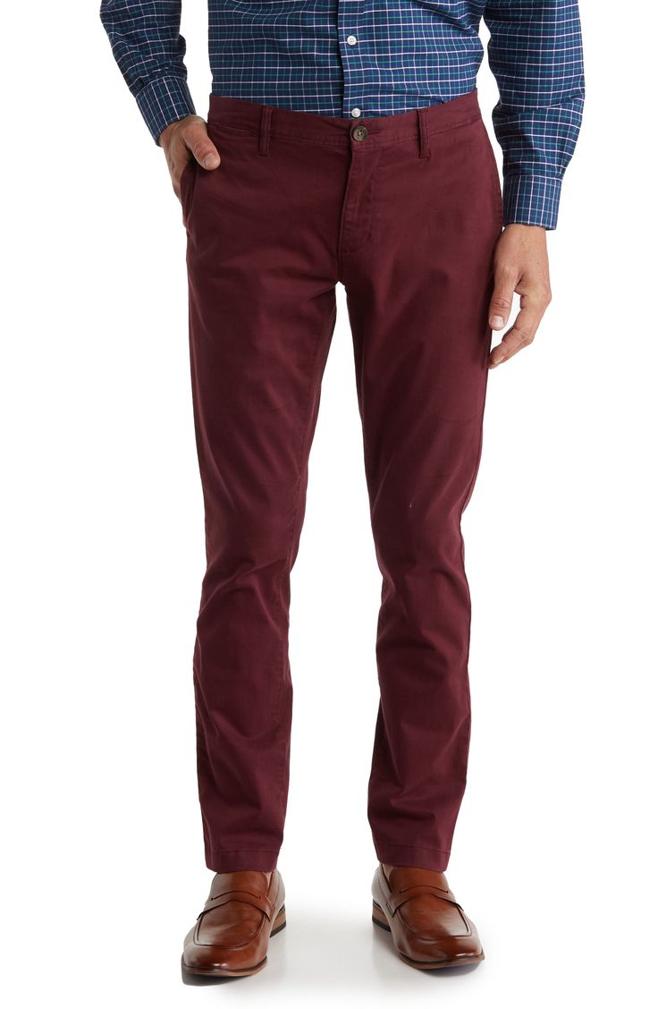 A solid hue makes these chino pants a versatile, everyday classic staple for your closet. 9" rise, 32" inseam (size 32x32) Trim fit Zip fly with button closure 2 front slash pockets; 2 back button welt pockets 97% cotton, 3% spandex Machine wash, tumble dry Imported Model stats: 6'1" height, 32" waist. Model is wearing size 32x32. Slim Fit Straight Leg Solid Chinos, Solid Color Slim Fit Straight Leg Chinos, Slim Fit Straight Leg Chinos, Fall Chino Cotton Twill Chinos With Welt Pockets, Fall Chino Cotton Twill Work Pants With Tapered Leg, Classic Chino Cotton Twill Pants For Fall, Solid Chino Cotton Twill Chinos With Straight Hem, Slim Fit Cotton Chinos For Business Casual In Fall, Slim Fit Chinos For Business Casual In Fall