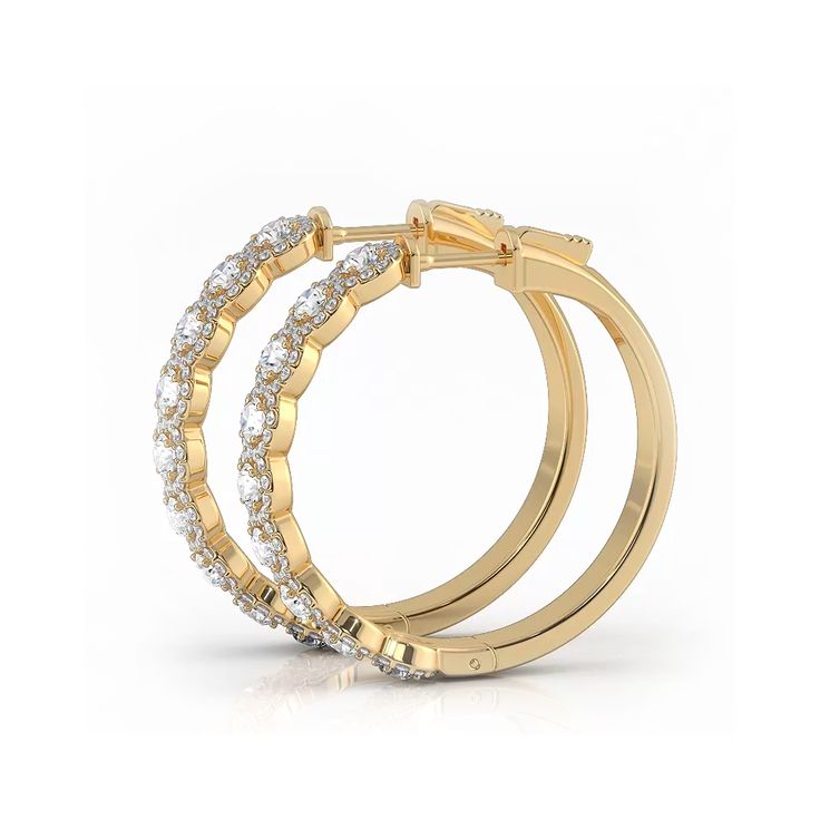 two gold rings with diamonds on each side