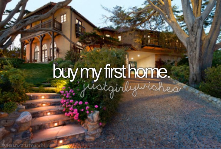 the words buy my first home are lit up in front of a house with steps leading to it