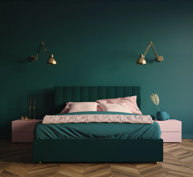 a bedroom with green walls and pink bedding in the center, along with two lamps on either side