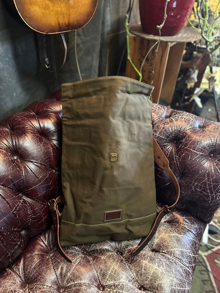 Simple design. Holds a lot of stuff. Heavy duty waxed canvas and leather dimensions approx 14”w X 18”h X 17”d imported Waxed Canvas Backpack With Leather Handles For Outdoor, Rugged Canvas Backpack For Everyday, Rugged Waxed Canvas Backpack For Everyday Use, Canvas Backpack With Tote Shape, Everyday Waxed Canvas Backpack With Leather Patch, Functional Waxed Canvas Leather Backpack For Daily Use, Waxed Canvas Backpack With Leather Handles For Everyday Use, Functional Leather Backpack With Waxed Canvas For Daily Use, Daily Use Leather Backpack With Waxed Canvas Lining