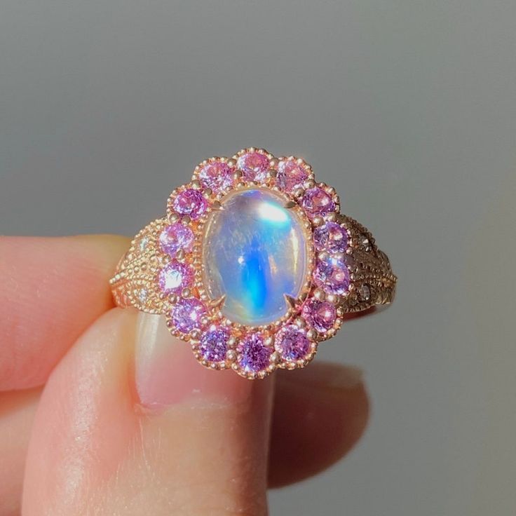 Edwardian Rainbow Moonstone With Pink Sapphire Halo Ring. - Etsy Pink Halo Diamond Ring, Pink Sapphire Jewelry As A Gift, Pink Halo Ring Jewelry, Pink Moonstone Promise Ring, Pink Moonstone Jewelry Gift, Handmade Pink Moonstone Jewelry, Pink Moonstone Ring Gift, Pink Round Moonstone Ring For Gift, Handmade Rose Gold Moonstone Ring For Anniversary