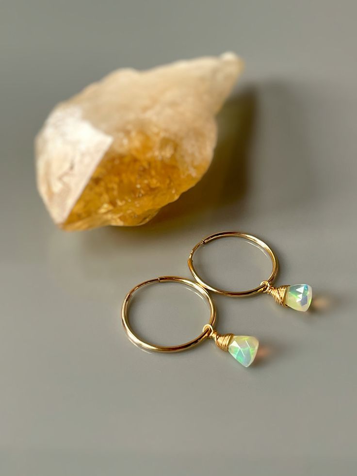 Sweet and dainty genuine Opal briolettes from the Wenlo mine are nested into gold fill wrapped settings and hang from 14k gold fill hoops. Opal size 5x7mm Photos are zoomed to show detail. Please note measurements and photos on model for scale. These handmade earrings do double duty. In the mood for nothing more than a shining gold hoop? Just slip the jewels off the end of each hoop and you have a simple gold hoop earring to wear anytime you please. I lovingly handcraft all jewelry and hair acce Stackable Huggie Earrings Fine Jewelry For Gift, Stackable Huggie Earrings As Gift In Fine Jewelry, 14k Gold Stackable Huggie Earrings As A Gift, Stackable Small Hoop Jewelry Gift, Stackable 14k Gold Hoop Earrings As Gift, Stackable Yellow Gold Earrings For Gift, 14k Gold Stackable Hoop Earrings As Gift, Gold Stackable Earrings 14k Gold Filled, Dainty Stackable Earrings For Anniversary