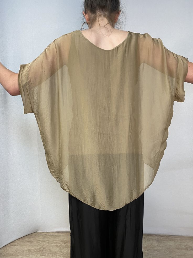 Meo Meli silk caftan top, One size,Camel color, very soft and stylish. Chic Silk V-neck Kaftan, Elegant Silk V-neck Tunic, Oversized Summer Blouse For Layering, Summer Batwing Sleeve Top For Layering, Silk Blouse For Summer Layering, Beige Silk Blouse For Summer, Summer Beige Silk Blouse, Elegant Airy Blouse For Summer, Elegant Short Sleeve Kaftan For Summer