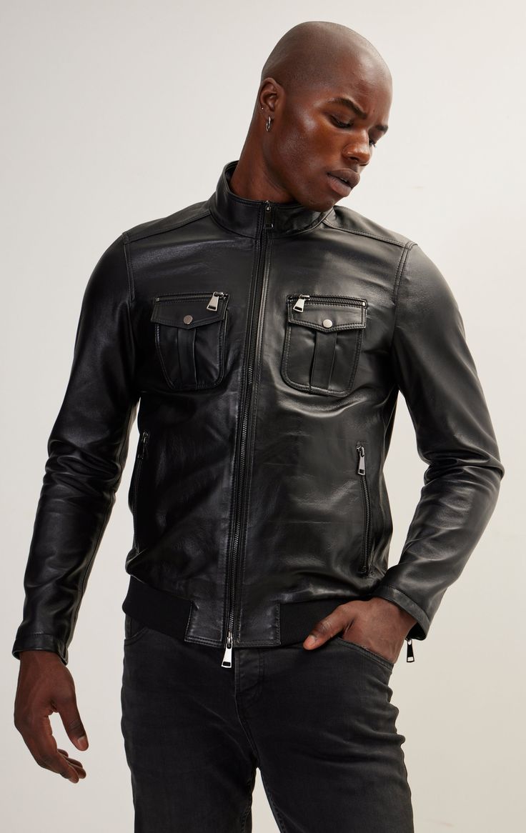 DETAILS Introducing the Double Zipper Stand Collar Leather Bomber Jacket, a fusion of style and functionality with attention to detail:-Stand Collar: The stand collar adds a modern touch, elevating the jacket's overall look.- Double Zipper Closure:Featuring a double zipper closure, this jacket allows for a customizable and versatile fit.-Zipper Closures on All Pockets:Practical and stylish, all pockets come equipped with zipper closures, ensuring both security and a contemporary aesthetic.- Slanted Side Pockets: The slanted side pockets add a dynamic and modern flair to the jacket's design.- Snap Closure on Chest Pockets: The addition of a snap closure on the chest pockets provides both functional convenience and a stylish accent.Elevate your wardrobe with the Double Zipper Stand Collar Le Luxury Black Leather Jacket With Zip Cuffs, Fitted Biker Jacket With Stand Collar And Pockets, Modern Black Leather Jacket With Long Sleeves, Classic Black Outerwear With Zip Cuffs, Black Business Leather Jacket With Zip Cuffs, Black Leather Jacket With Zip Cuffs For Business, Modern Black Leather Jacket With Zip Fly, Modern Black Leather Jacket, Modern Black Leather Jacket For Spring