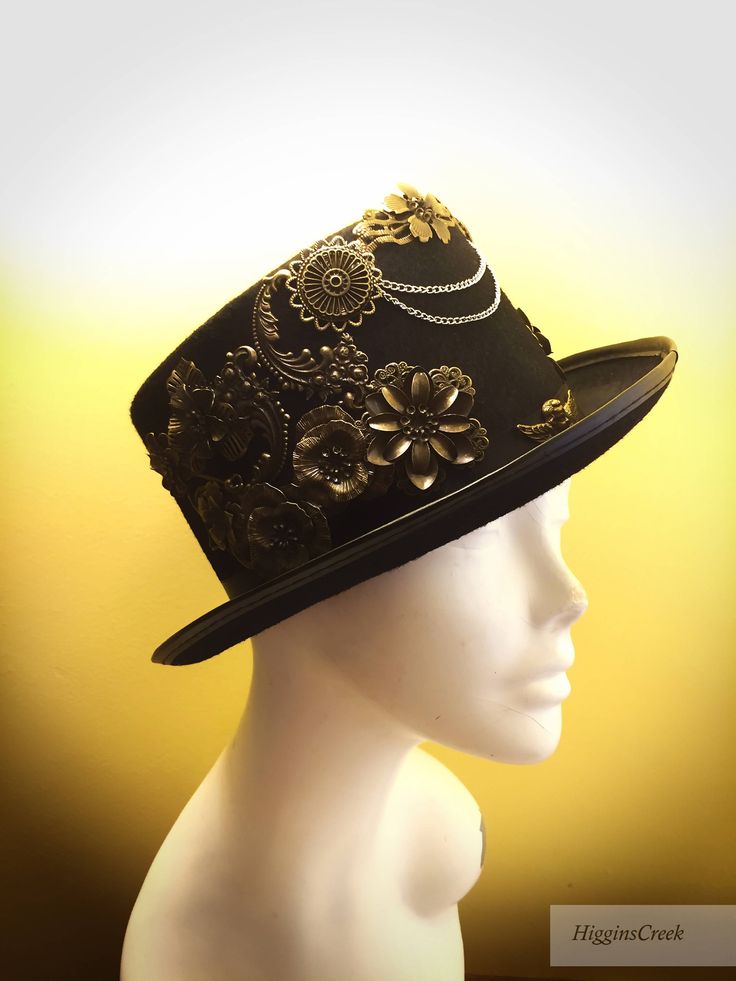 "Neo-Victorian top hat combining a vintage Victorian style with subtle eccentricity of mechanical aesthetic of steampunk, this unisex top hat is fitted with a variety of Victorian vintage baubles and fantastical cogs & gear ornaments on a formed Felt hat with with Ribbon Band. Choosing the custom theme Hat option? Whether you are a high-society aristocrat, a brilliant Steam engineer or a greasy Steam-machine mechanic, your customized hat will work wonderfully with almost any ensemble. S I Z Steampunk High Crown Costume Hat, Steampunk Mini Hat With High Crown, Steampunk Top Hat With Curved Brim For Costume, Steampunk Costume Hat With Curved Brim, Steampunk Mini Hats For Festivals, Vintage High Crown Top Hat For Costume Party, Vintage Top Hat For Costume Party, Black Steampunk Top Hat For Alternative Fashion, Vintage Top Hat With Curved Brim For Costume Party