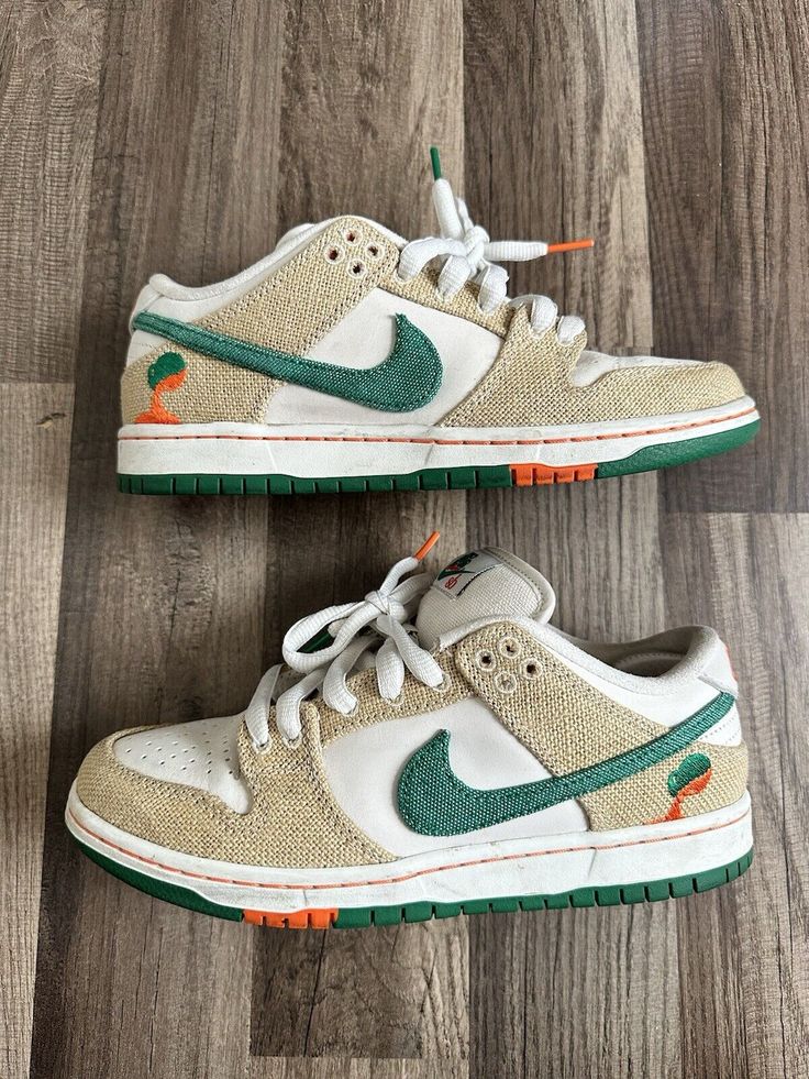 Elevate your sneaker game with these Nike SB Dunk Low x Jarritos in size 7. The shoe features a low top style code with a white colorway and phantom, safety orange, and malachite accents. The sneaker is made with premium materials and is designed for athletic use, specifically skateboarding. The Nike SB Dunk Low x Jarritos is a collaboration model released in 2023, with the product line being Nike SB. The shoe is perfect for men who enjoy sneakers and want a stylish and functional addition to their wardrobe. The release date is 20230511, and the shoe is pre-owned. Get your hands on this amazing sneaker today! Shoes For Skateboarding, Nike Dunk Low Men, Dunks Men, Jordan Dunks, Streetwear Shoes, Nike Sb Dunk Low, Sb Dunk Low, Nike Sb Dunks Low, Nike Sb Dunk