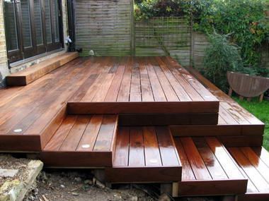 a wooden deck with steps leading up to it