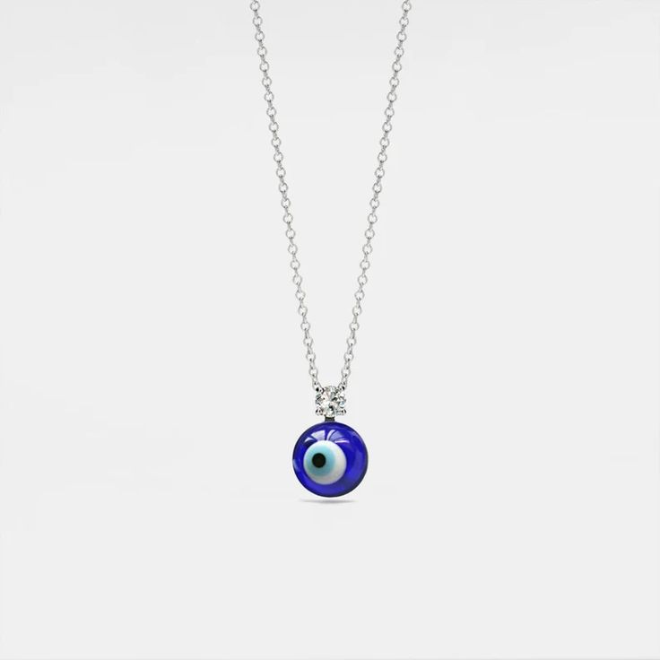 Description & Details Ward off negativity and embrace protection with our stunning designs. Imbued with ancient symbolism, our evil eye jewelry combines style and spirituality, allowing you to accessorize with purpose and positive energy. • Material: Solid 925 Sterling Silver ∙ Cubic Zirconia ∙ Glass ∙ Enamel• Finish: Hypoallergenic ∙ Gold Plating• Dimensions: 10 mm ball charm, 40 - 45 cm chain, adjustable• All our work is custom made by hand with love Spiritual Charm Necklaces With Adjustable Chain, Spiritual Charm Necklace With Adjustable Chain, Evil Eye Pendant Jewelry For Good Luck, Symbolic Evil Eye Round Pendant Necklace, Evil Eye Amulet Jewelry For Good Luck, Spiritual Evil Eye Pendant Jewelry, Symbolic Round Evil Eye Jewelry, Symbolic Evil Eye Jewelry For Meditation, Symbolic Evil Eye Jewelry