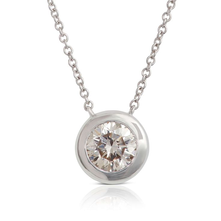 A bezel set diamond pendant is the perfect way to add a touch of modern-chic style and sparkle to your unique look. Modern Solitaire Necklace With Single Round Cut Diamond, Modern Solitaire Round Diamond Necklace, Modern Round Cut Solitaire Necklace, Modern Round Solitaire Necklace For Formal Occasions, Modern Round Solitaire Necklace For Formal Events, Timeless Round Solitaire Necklace With Tension Setting, Round Solitaire Necklace With Tension Setting, Modern Solitaire Necklace With Brilliant Cut, Modern Round Solitaire Necklace With Brilliant Cut