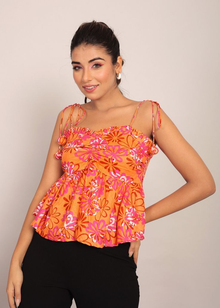 *The floral print, an exquisite medley of vibrant colors, transforms this crop top into a wearable garden of enchantment.  *The square neckline adds a touch of modern sophistication, creating a perfect blend of timeless charm and trendy allure.  *With sleeveless elegance, this top is designed for those sun-soaked days or nights out on the town.  *Tailored to be fitted at the bust, this crop top highlights your feminine curves while providing a flattering and comfortable silhouette.  *Crafted from soft and breathable cotton fabric, it ensures a luxurious feel against your skin, promising comfort that lasts all day.  *The top wear length gracefully reaches the waist, offering a versatile canvas for styling - pair it with high-waisted bottoms for a chic ensemble that effortlessly transitions Fitted Multicolor Floral Print Tank Top, Spring Printed Sleeveless Crop Top, Printed Sleeveless Crop Top For Spring, Sleeveless Printed Crop Top For Spring, Summer Printed Orange Blouse, Sleeveless Printed Crop Top For Summer, Printed Sleeveless Crop Top For Summer, Vibrant Fitted Multicolor Tops, Printed Crop Top Tank For Spring