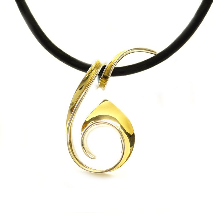 Gold & Silver Necklace - Drawing inspiration from the flowing lines and delicate curls found in nature, this hand-forged anticlastic pendant necklace feels effortless while being visually stunning. Crafted from highly polished sterling silver and 18k gold bimetal.<br><br>Choose cord type:<ul><li>Black leather cord</li><li>Black rubber cord</li></ul>Choose clasp type:<ul><li>Lobster clasp</li><li>Bayonet clasp</li>& Elegant Yellow Gold Swirl Jewelry, Elegant Spiral Sterling Silver Necklaces, Elegant Sterling Silver Spiral Necklace, Elegant Swirl Necklace For Gift, Elegant Swirl Necklace For Gifts, Elegant Sterling Silver Swirl Necklace, Elegant Yellow Gold Spiral Necklace, Elegant Spiral Hand Forged Jewelry, Elegant Hand Forged Spiral Jewelry