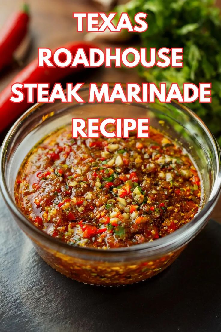 a glass bowl filled with steak marinade next to red peppers