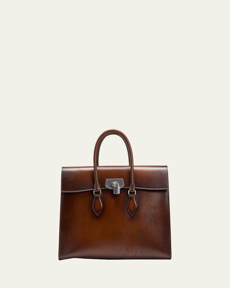 Berluti "E'Mio" briefcase bag in smooth calfskin    Scritto signature on front    Rolled top handles    Top flap with padlock closure    Two interior compartments with center zip pocket    Mobile phone pocket    Shoehorn pocket    Flat pocket with Drings at back    Approx. 13.65"H x 22.3"W x 6.95"D    Made in Italy Formal Cognac Briefcase With Top Carry Handle, Classic Briefcase With Detachable Handle For Business Trips, Luxury Cognac Briefcase For Formal Occasions, Luxury Cognac Briefcase, Formal Briefcase With Palladium Hardware And Top Handle, Luxury Top Handle Briefcase With Smooth Grain, Formal Cognac Briefcase With Top Handle, Cognac Top Handle Briefcase For Formal Use, Luxury Leather-lined Briefcase With Top Handle