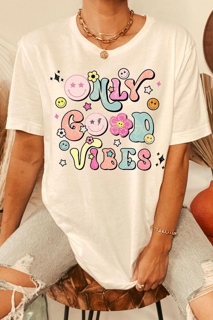 Trendy Multicolor T-shirt With Text Print, Fun Cotton T-shirt With Graphic Design, Funny White T-shirt With Letter Print, Spring Fun Graphic T-shirt, Multicolor Cotton T-shirt With Funny Print, Colorful Casual T-shirt With Letter Print, Retro White T-shirt With Funny Print, Colorful Graphic Print T-shirt For Spring, Groovy Graphic Print Short Sleeve T-shirt