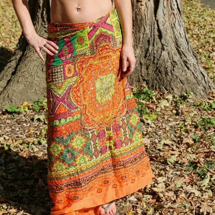 Orange Metallic Beach Wrap - Cotton, Boho Sarong. Shown as a skirt. Sequin Details Bohemian Sarong For Beach Party Resort, Cotton Sarong For Beach Vacation, Cotton Sarong For Beach Season Vacation, Green Bohemian Sarong For Summer, Multicolor Cotton Vacation Sarong, Multicolor Cotton Sarong For Vacation, Fitted Bohemian Sarong For Summer, Hippie Style Sarong For Summer Beach Cover-up, Summer Beachwear Cotton Sarong