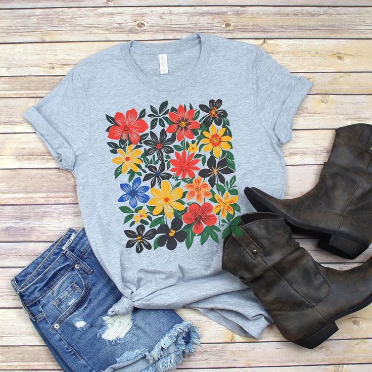 Boho Daisy ~ Flower Tee Shirt, Botanical Tee, boho Tee, wildflower shirt, plant shirt botanical shirt, retro floral T-shirt, gardener,trendy How to Order Choose your shirt color Choose the quantity Add the item to your cart -- If you need multiple shirts, you can add them to your cart one by one to place a single order. Production and Shipping After you place your order, we will process it within 1-3 business days. Once your order is shipped, delivery time will depend on the shipping option you choose. If you need to expedite your order, you can contact us directly through messages, and we will provide you with our rush options. Designs The designs on your computer screen may appear different from the actual product; they may look too fresh, crisp, or shiny on the screen, but the designs c Patterned Floral Print Cotton T-shirt, Spring Patterned Tops With Plant Print, Casual Patterned Top With Plant Print, Hippie Multicolor T-shirt For Spring, Casual Multicolor Vintage Print T-shirt, Floral Print Cotton T-shirt, Multicolor Floral Print T-shirt For Summer, Bohemian Multicolor Print Summer Shirt, Spring Patterned Shirt With Graphic Print