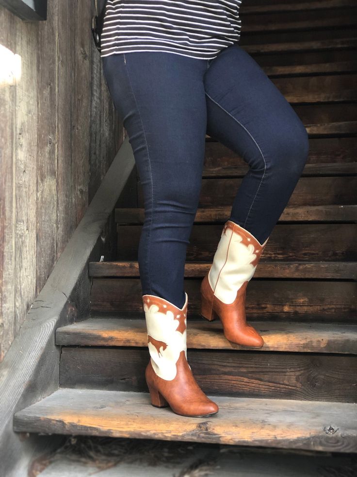 1950's Inspired Bucking Horse Adorned Western Boots. Proud To Be 100% Vegan Friendly. Upper Material: Faux Textured Leather Lining: Man Made + Fabric Step In Boot w/ Inner Tab For Easy Access. Heel Height: 3" Inches Approximate Shaft Height: (based on size 6 from top to back counter) 7 1/2" Inches / Mid Calf Height Fits True To Size, Please Size Up 1/2 If You Take A Wider Width. For Any Sizing Suggestions, Please Contact Customer Care. Imported Bucking Horse, Customer Care, Proud To Be, Western Boots, Vegan Friendly, Mid Calf, Easy Access, Riding Boots, Heel Height