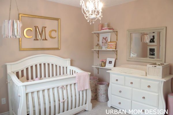 an image of a baby's room with pink and gold accents