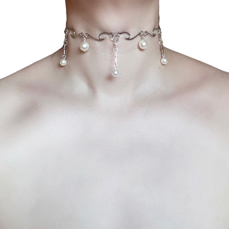 The Holy Havoc Choker 🖤 Meet The Holy Havoc Choker, a sacred symphony of spiked wave connectors and shimmering pearls, adorned with three defiant crosses that blur the lines between heaven and hell. 🖤 Only one available as I like to make one of a kind pieces so that you have a unique, standout, rare, special piece that you can't find anywhere else. 🖤 Care Instructions: Keep your jewellery away from water, oils, perfumes and make sure to remove before showering and sleeping in order to keep it in it's best condition. *All intellectual property rights in our designs are and will belong to Sphider Ltd Any infringement will be pursued vigorously. Sphider Design Unique, Quirky, Grungegirl, Mythology, Whimsigoth, Alt, EGirl, handmade Fair Core, Alt Egirl, Black Beret, Ren Fair, Winter Inspired, Property Rights, Heaven And Hell, Intellectual Property, Choker Necklaces