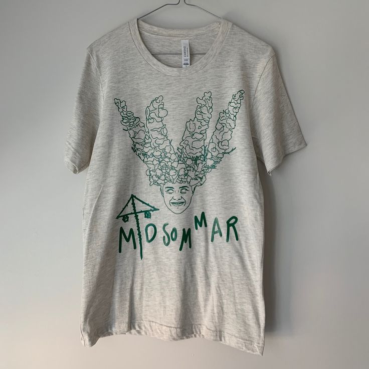 Canada Post is on strike as of November 15th which means no deliveries will be shipped out.  If you still choose to make a purchase at this time expect major delays on  shipping and arrival time    Midsommar | May Queen | A24 | Florence Pugh | Test Sample Unisex T-Shirt If you are a fan of horror, A24 and Midsommar this might be the shirt for you. There is one t-shirt size small:  Green vinyl on a Heathered natural t-shirt Gender neutral soft - 99% cotton 1% polyester  design on front and on the Summer Band Merch T-shirt With Screen Print, Summer Band Merch T-shirt, Summer Band Merch T-shirt With Front Print, Band Merch T-shirt With Front Print For Summer, Green Band Merch T-shirt For Summer, Fan Merchandise T-shirt With Front Print For Spring, Summer Band Merch T-shirt Pre-shrunk, Summer Band Merch T-shirt, Pre-shrunk, Summer Band Merchandise T-shirt