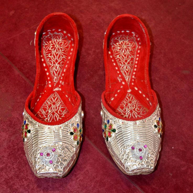 Handmade Pure Silver Women's Shoes | US Size 5 | Unique Stylish Footwear PRODUCT NAME ~ Pure Silver Women Jutti US Size 5 LENTH ~ 9.5 INCH MATERIAL ~ 925 Sterling Silver Step into the world of timeless Punjabi craftsmanship with our exquisite Punjabi Silver Jutti, a perfect blend of tradition and style. These stunning juttis are meticulously handcrafted to add a touch of ethnic elegance to your attire, whether you're dressing up for a special occasion or simply want to elevate your everyday look Festive Silver Traditional Wear With Gota Work, Silver Gota Work Traditional Wear For Festive Occasions, Silver Traditional Wear With Gota Work For Festive Occasions, Festive Wedding Shoes With Handwork And Round Toe, Bollywood Style Festive Wedding Shoes With Round Toe, Wedding Shoes With Zari Work For Festivals, Wedding Shoes With Dori Work For Festivals, Festive Zari Work Wedding Shoes, Festive Wedding Shoes With Dori Work