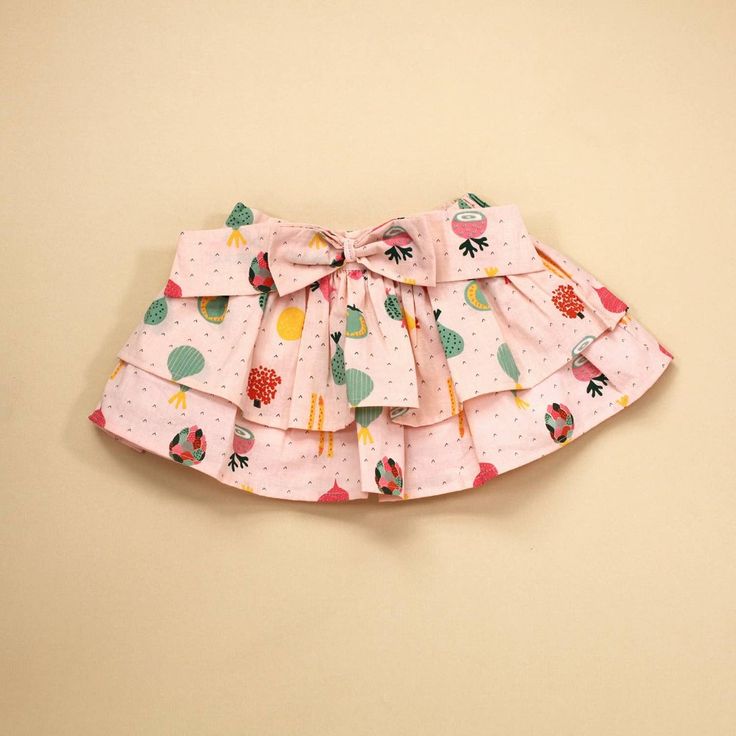 Super Cute Two Tier Skirt For Baby Girl. Featuring An Elastic Waist Band And Bow Detail. Skirt Is Made Of A Blush Colored Base With A Soft, Breathable Certified Organic Cotton To Make For A Comfy, Non Toxic, Durable & Eco-Friendly Choice. Ethically Produced By Small Farmer Sourced Organic Cotton At Fairtrade Certified Facility In India. 100% Organic Cotton Care Instructions: Machine Wash Cute Cotton Ruffle Skirt, Cute Cotton Ruffled Skirt, Cute Cotton Skirt With Ruffles, Cute Cotton Tiered Skirt, Cute Tiered Cotton Skirt, Cute Cotton Mini Skirt, Cute Cotton Lined Skirt Bottoms, Cute Cotton Lined Skirt, Cute Cotton Bottoms With Lined Skirt