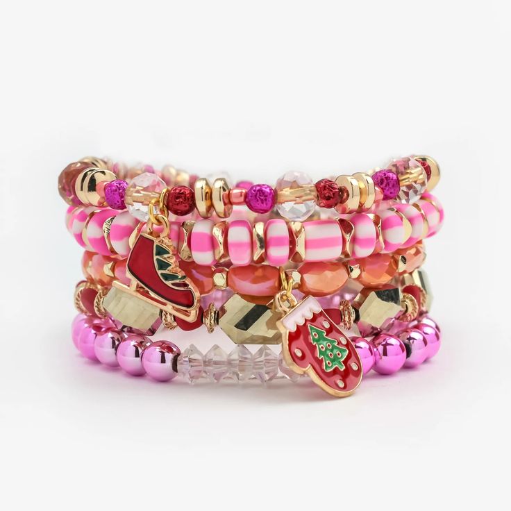 Erimish "MITTENS" Stack Bracelet Set INFO Holiday Collection Our Mittens Stack has the bold, eclectic pieces your wrist stack is missing. Vibrant pink & orange crystal beaded bracelets mixed with metallics and 2 attached charms complete the look. Bracelets are 'one size fits most' and are designed to fit wrists up to 7.5" comfortably. Lead & Nickel Free Please be aware that due to the unique and handmade nature of each product, colors, shapes, and bead sizes may vary slightly from the photos and descriptions. Pink Spacer Beads Bracelets For Party, Pink Party Bracelets With Spacer Beads, Multicolor Stackable Beaded Bracelets For Party, Pink Faceted Beads Bracelets For Party, Multicolor Stackable Crystal Bracelets, Adjustable Pink Stackable Charm Bracelet, Trendy Pink Stretch Bracelet With Faceted Beads, Adjustable Stackable Pink Charm Bracelet, Trendy Pink Bracelet With Faceted Beads